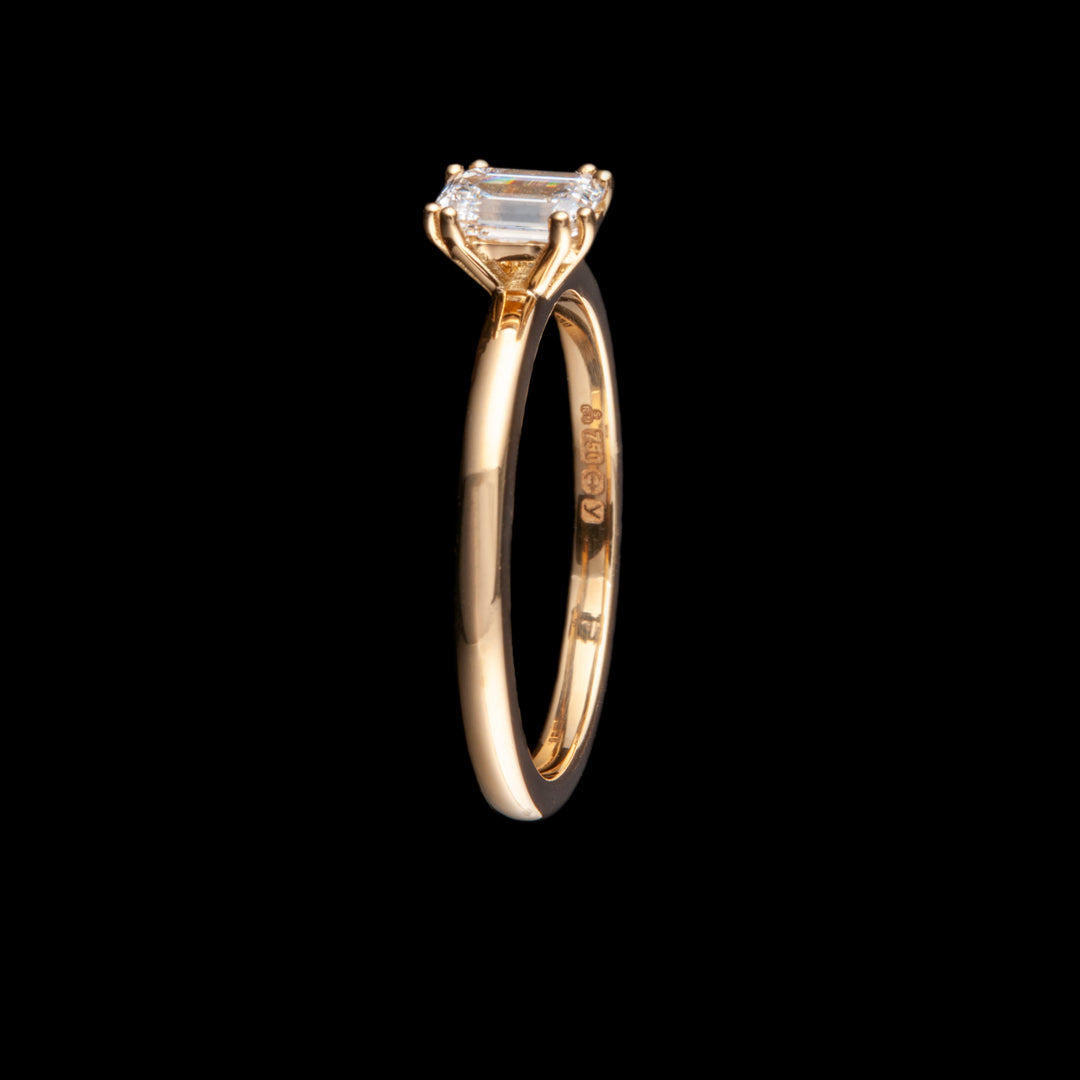 A beautiful gold engagement ring holding a fabulous diamond in its 4 claws. This ring was made for a client in Canada and whilst we have shown the hallmark they also have personalised engraving hidden inside the ring as well.