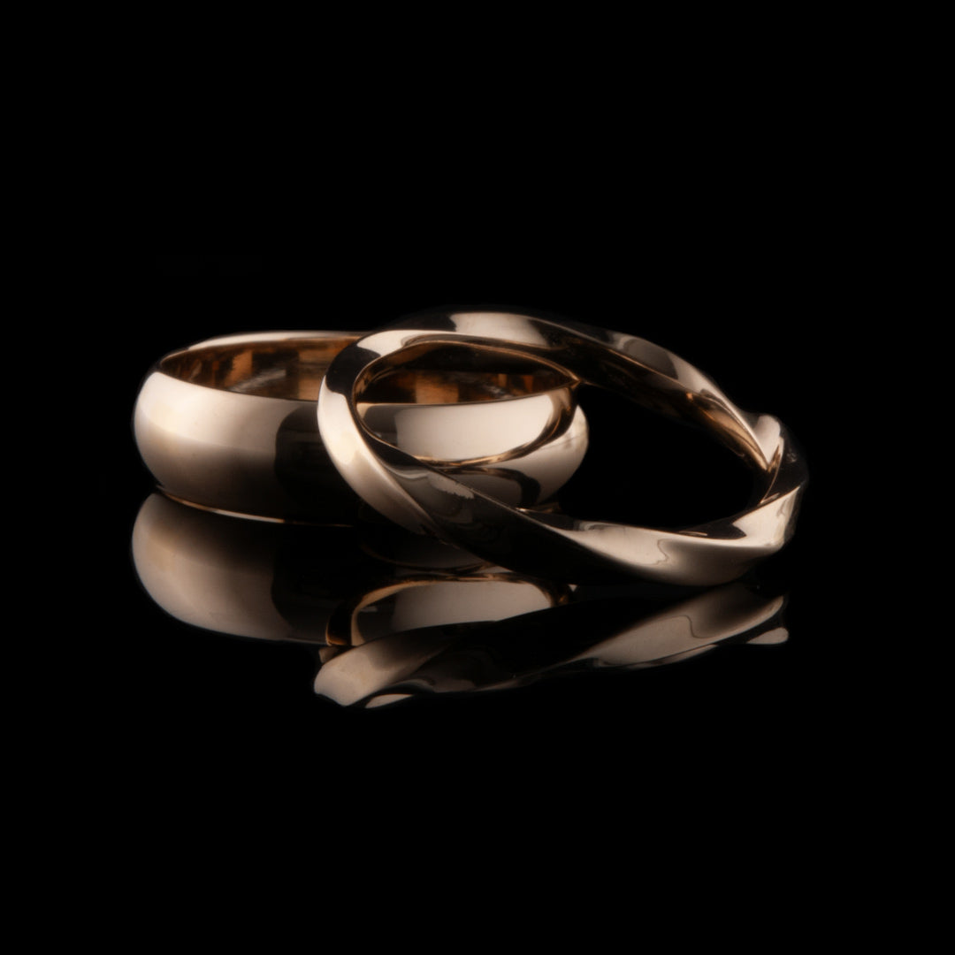 A lovely wedding rings jewellery commission where the bride wanted an ancient Irish ring design recreated by NI Silver and the groom was a more modern design for his ring.