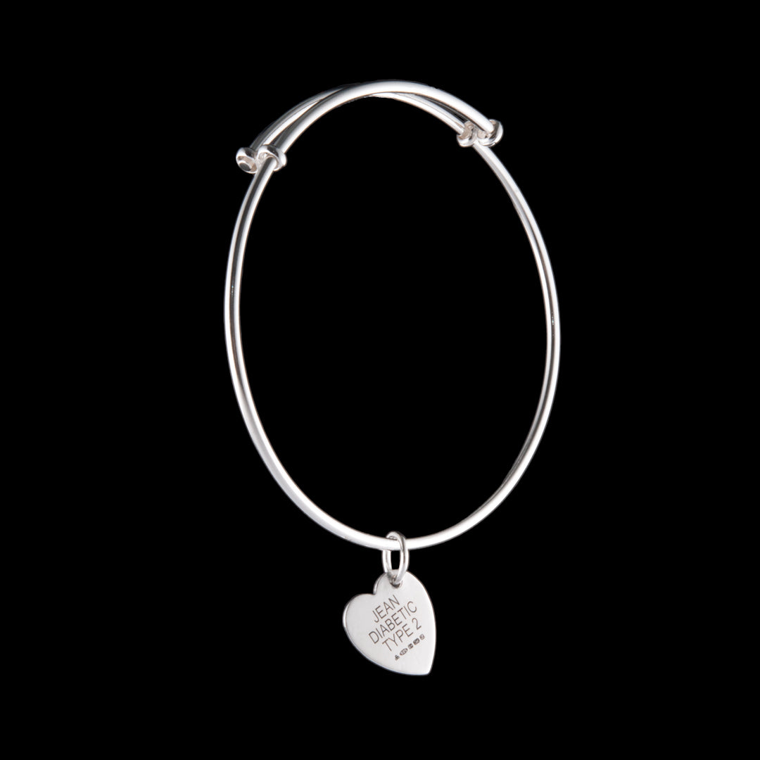 A medical alert bangle jewellery commission for NI Silver where the brief was to make a bangle which was stylish whilst also displaying the important medical alert information.  Hallmarked sterling silver was used for this bespoke piece of jewellery.