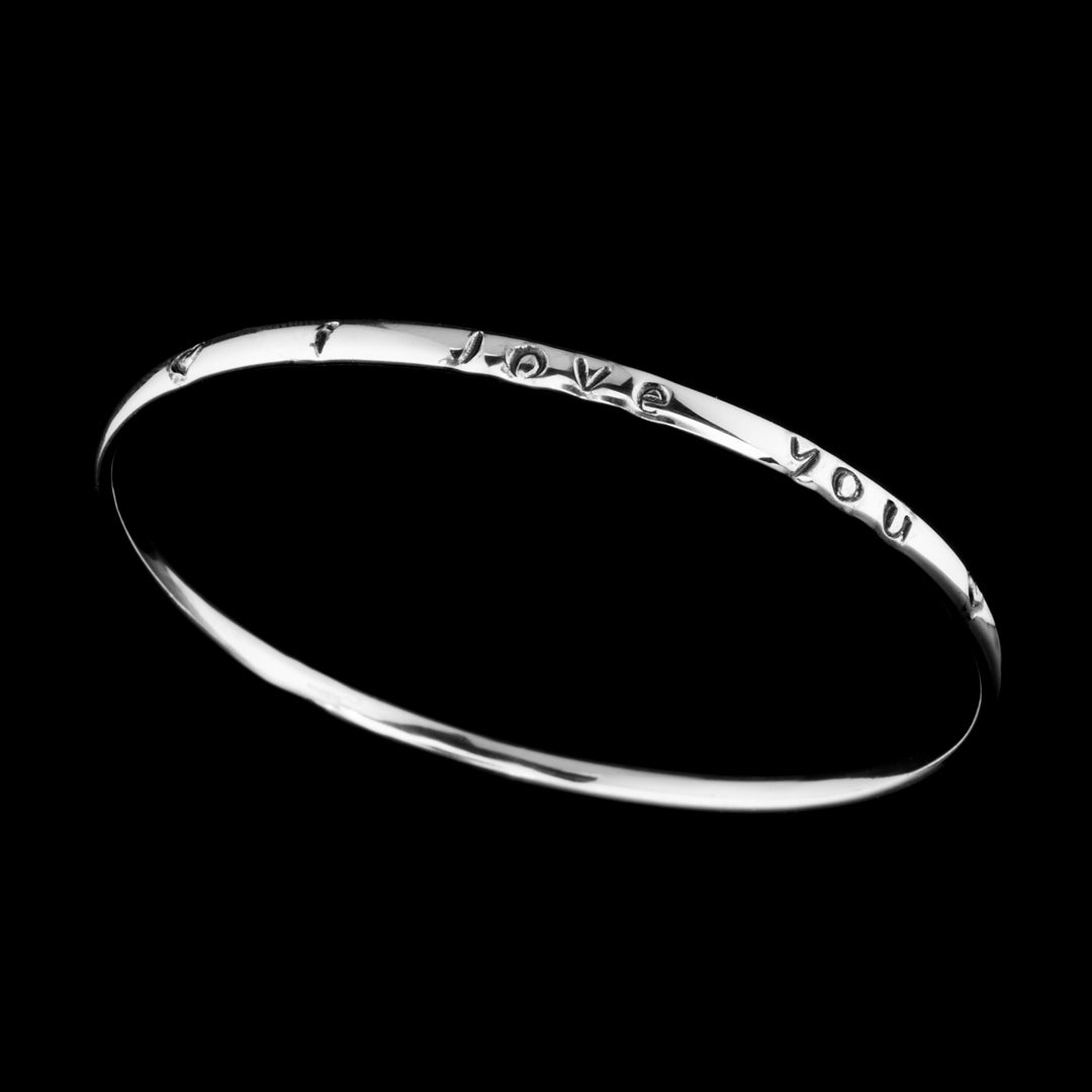 NI Silver Jewellery handmade 925 silver bangle with I Love You stamped word across it. Want to make your own version of this? Come on one of our jewellery making workshops.