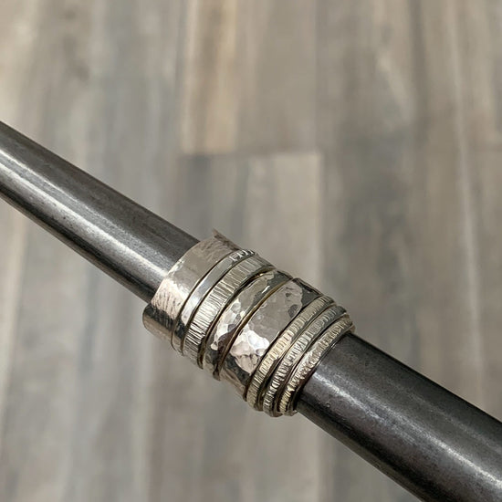 8 different styles of silver rings are shown next to each other.  Each style can be made during our NI Silver jewellery making experiences.