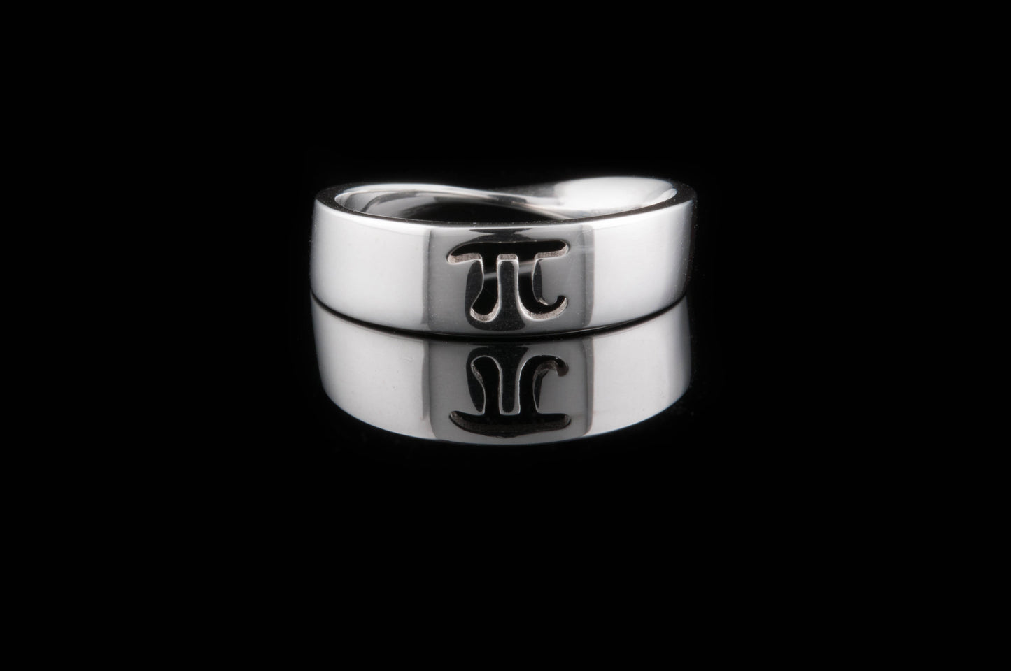 Mobius ring with the Pie symbol cut through the band in the centre point.