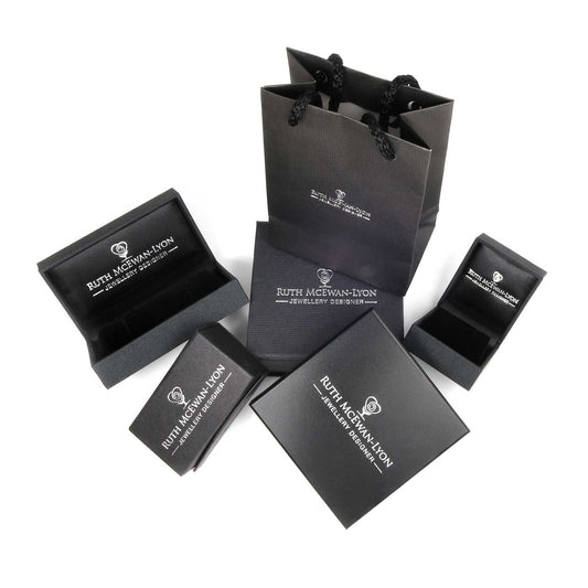 NI Silver gift packaging for your purchased silver jewellery. Biodegradable boxes and bags with Ruth McEwan-Lyon Jewellery Designer stamped on them.