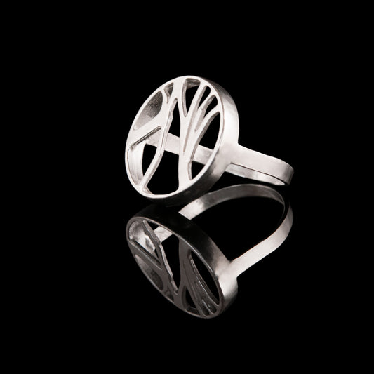 This is our NI silver Dark Hedges ring. You can see through the tree branches and this design has engraving over the top part of the ring band.