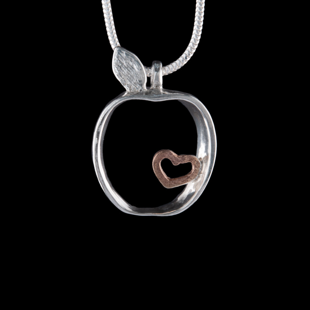 Armagh Apple Silver with  gold plating to the heart necklace, see through, on a snake chain.