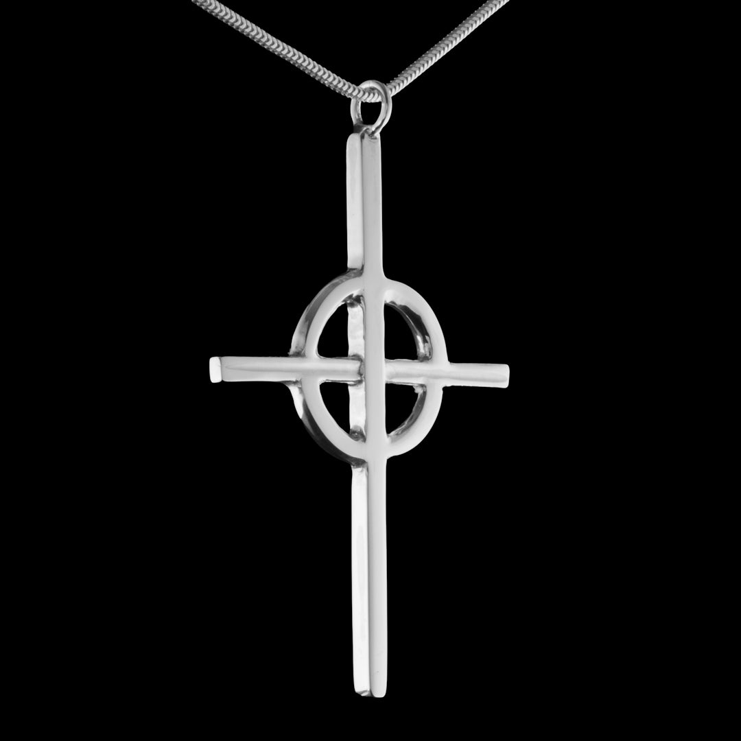 A handmade sterling silver Methodist cross pendant necklace, suspended from a matching chain against a solid black background.  A jewellery commission completed by NI Silver Jewellery of Holywood, Northern Ireland