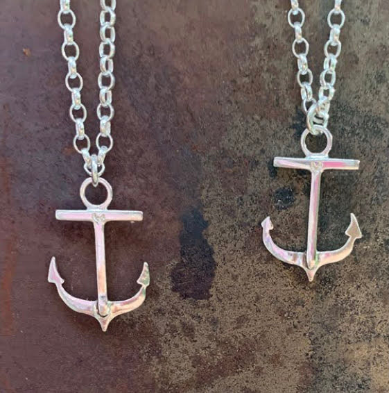 Photo shows 2 anchor necklaces hanging on their chains. These were commissioned and bespoke.