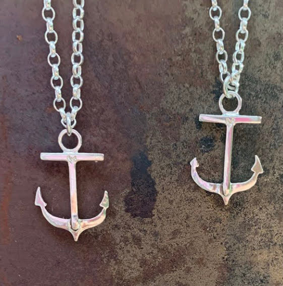 Photo shows 2 anchor necklaces hanging on their chains. These were commissioned and bespoke pieces for the client