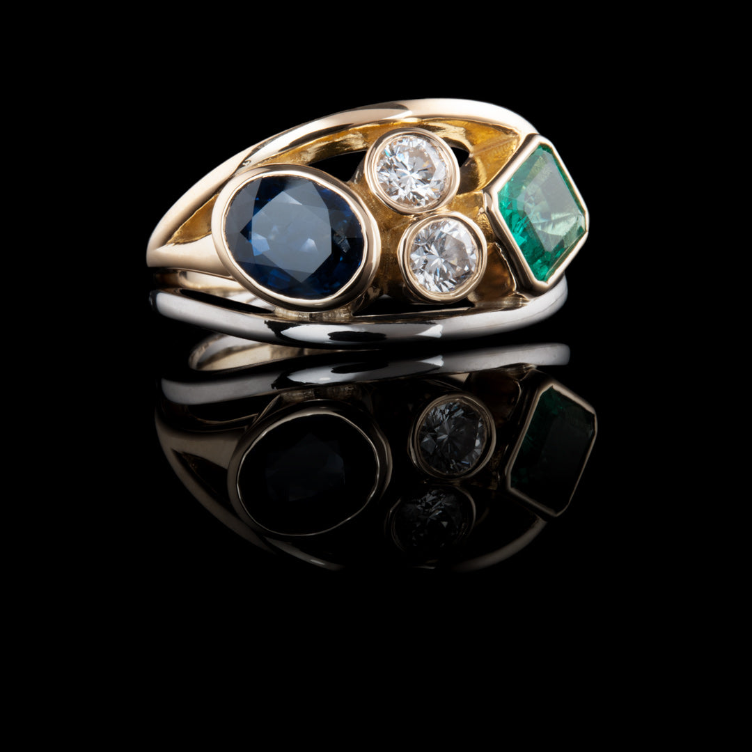 Bespoke jewellery commissions Belfast Northern Ireland by NI Silver Jewellery, This shows a gold and platinum ring with diamonds, an emerald and a sapphire a beautiful ring commission.