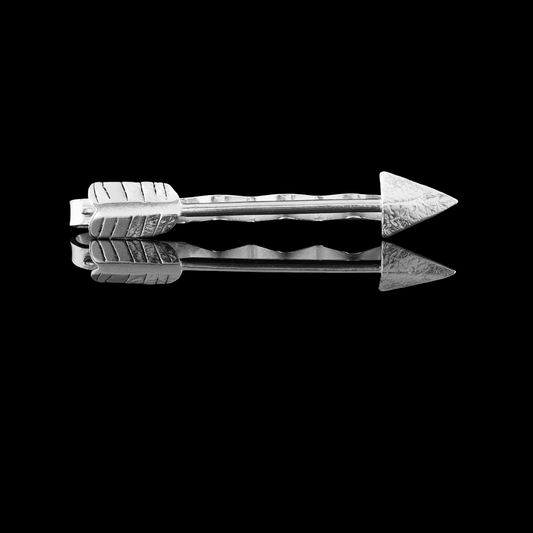 A sterling Silver Arrow it clip .  The arrow has been handmade and soldered onto a pre-made tie clip.