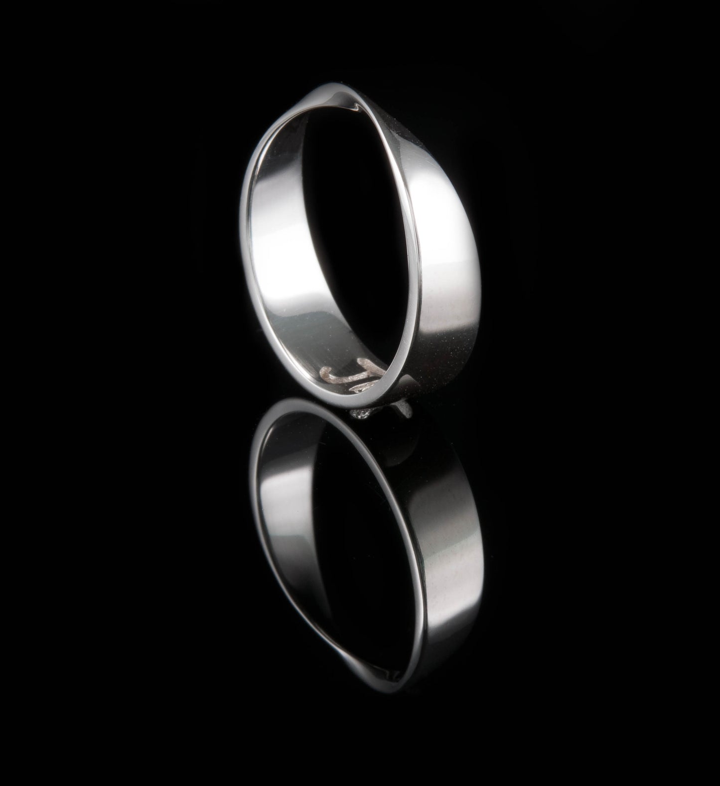 Mobius ring with the Pie symbol cut through the band in the centre point.