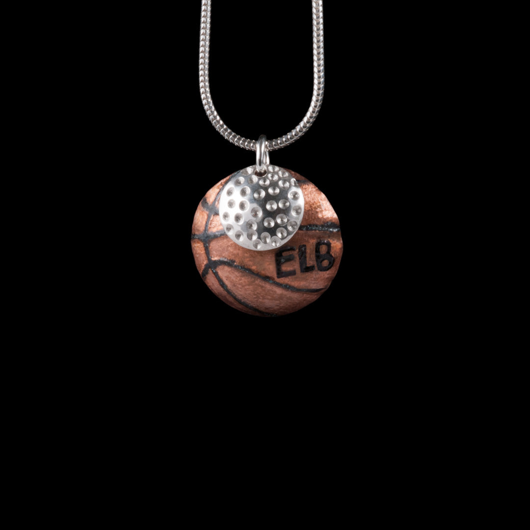 Basketball and Golf ball necklace jewellery commission by Ruth McEwan-Lyon of NI Silver.