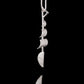 Side profile of our Tall Ships silver necklace.