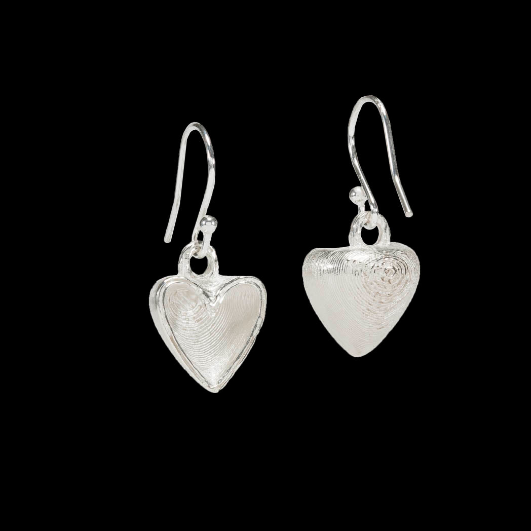 Love heart earrings sliced in half and hollow inside.  Solid sterling 925 silver.