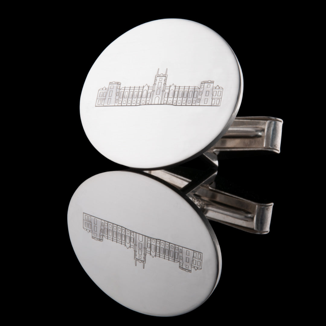 A closeup image of these Silver hallmarked cufflinks showing the facade of the Queens University Lanyon Building across the middle. Made by NI Silver.