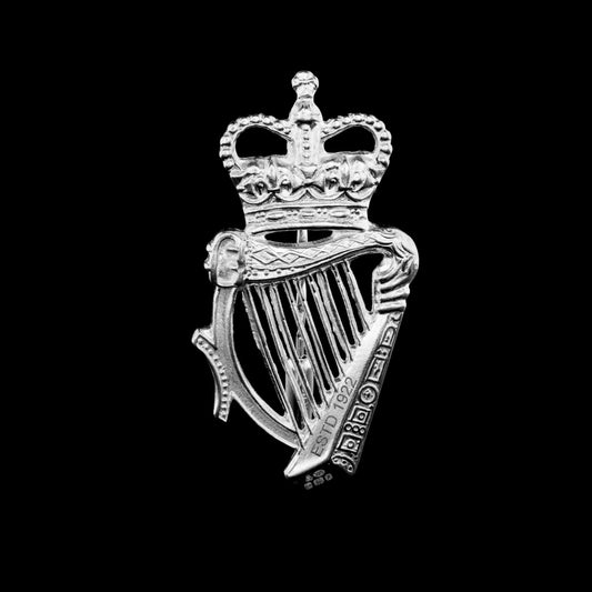 This is a solid silver RUC Cap badge made to be worn as a lapel pin.