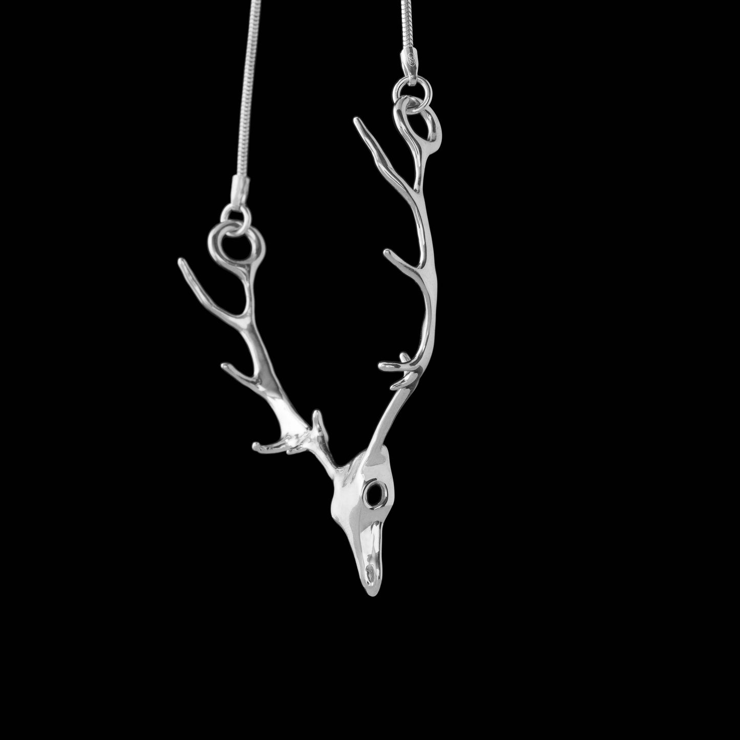Stag antler necklace made in sterling silver with a silver chain.