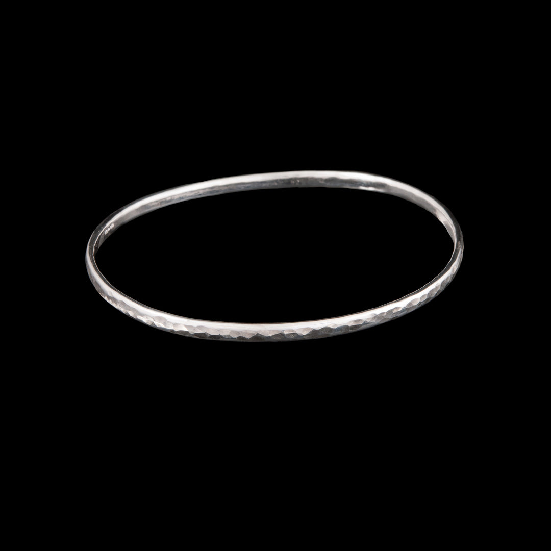 Silver Bangle handmade and hit with a hammer to create a textured pattern.  Sterling Silver made in Holywood Northern Ireland by Northern Irish Jewellery designer Ruth McEwan-Lyon