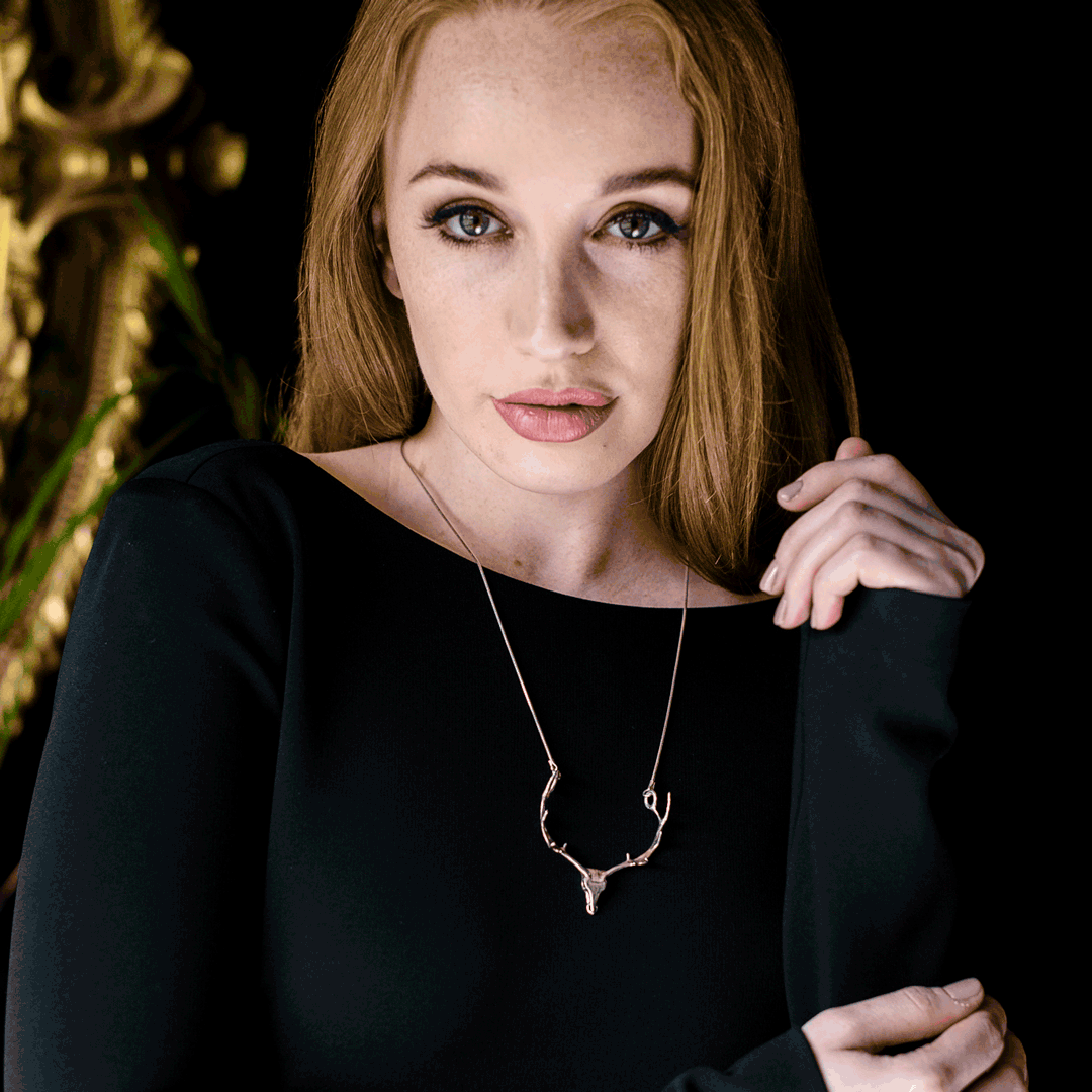 The NI Silver Jewellery Irish Elk antler necklace design made in sterling silver being worn by a model.