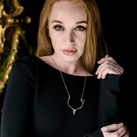The NI Silver Jewellery Irish Elk antler necklace design made in sterling silver being worn by a model.