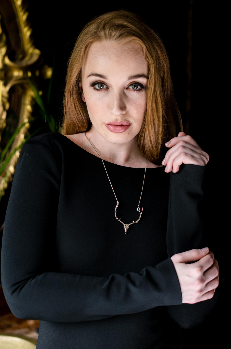 The NI Silver Jewellery Irish Elk antler necklace design made in sterling silver being worn by a model.